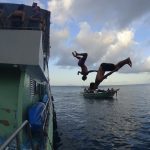 blanco-boat-party-koh-phi-phi-thailand-boys-back-flipping-off-the-boat